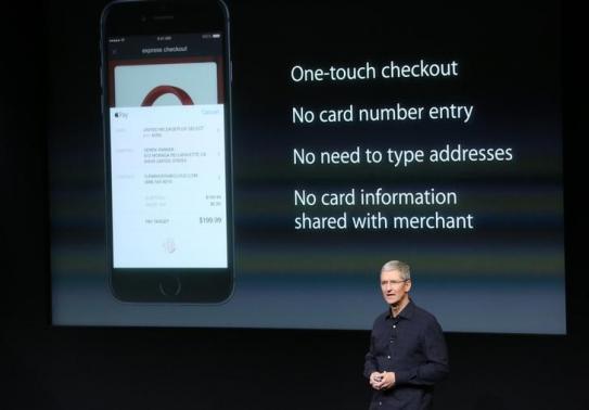 Apple CEO Tim Cook speaks about the Apple Pay service during a presentation at Apple headquarters in Cupertino